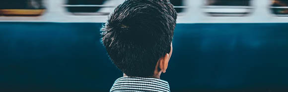 Person Looking at a Train Going By